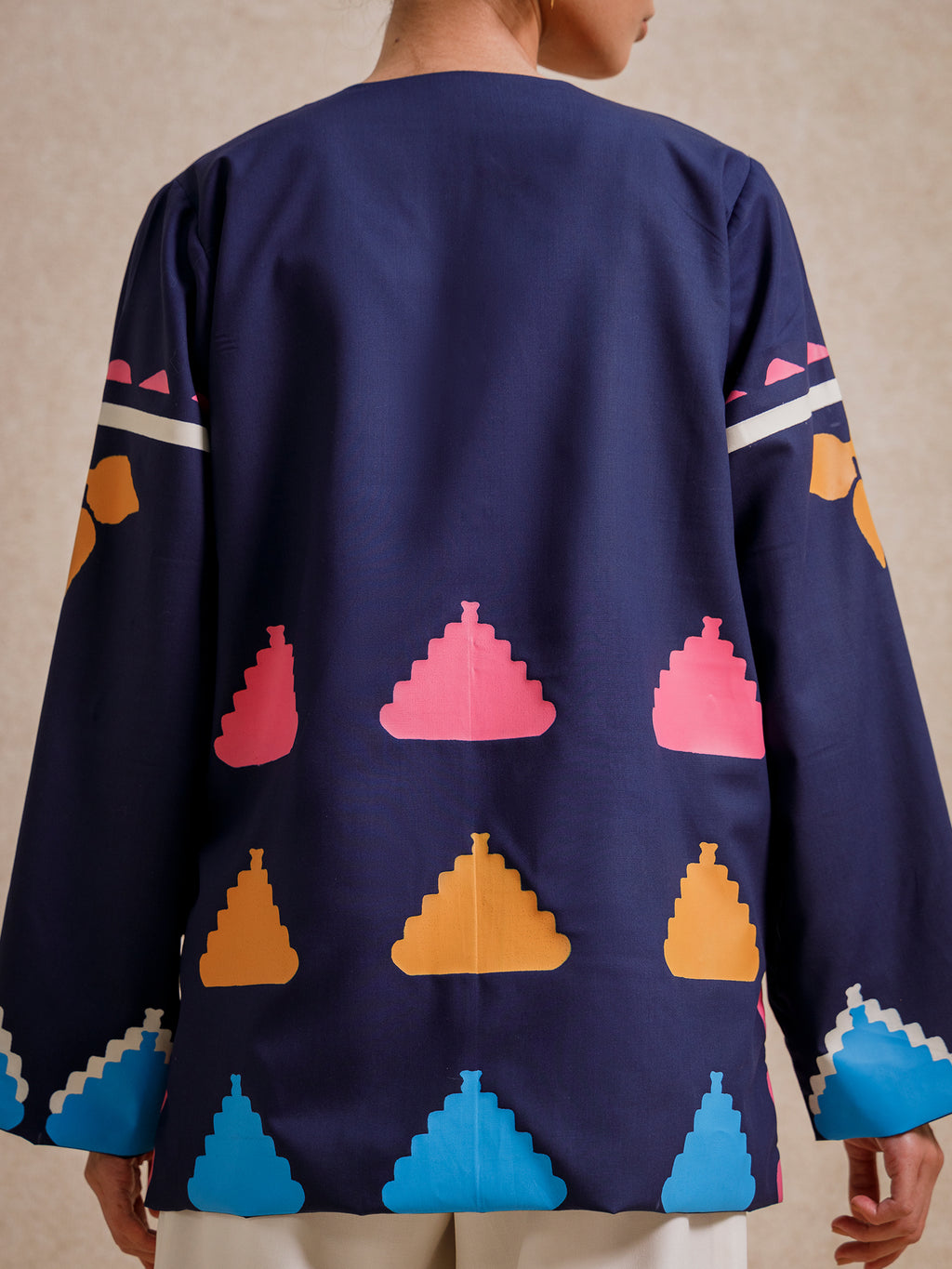 Back detail of Medici Dream blue short jacket with geometric screen-printed motifs