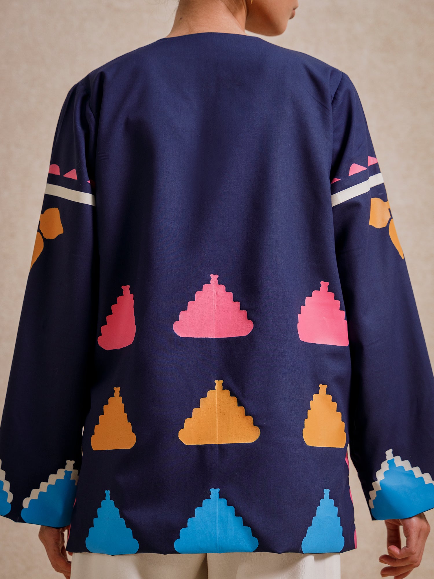 Back detail of Medici Dream blue short jacket with geometric screen-printed motifs