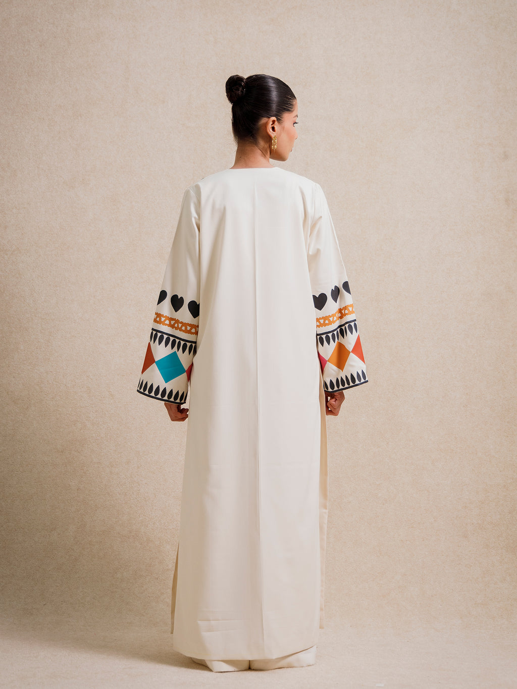 Back view of the Meso Caramel long kimono highlighting its clean silhouette and patterned sleeves