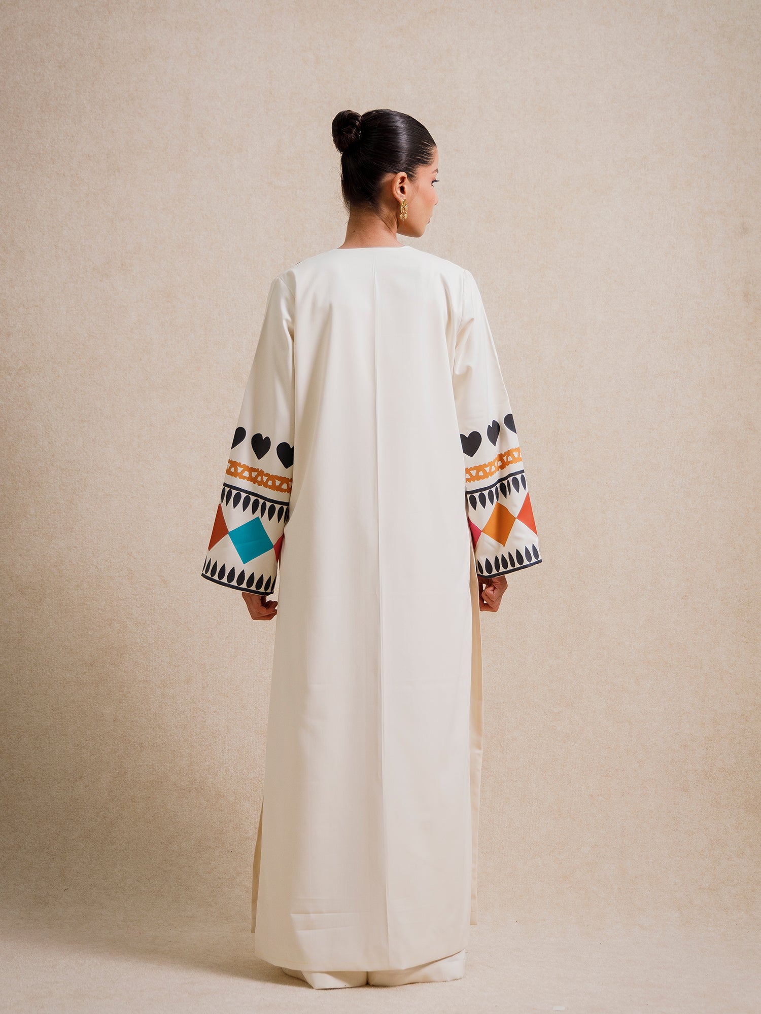 Back view of the Meso Caramel long kimono highlighting its clean silhouette and patterned sleeves