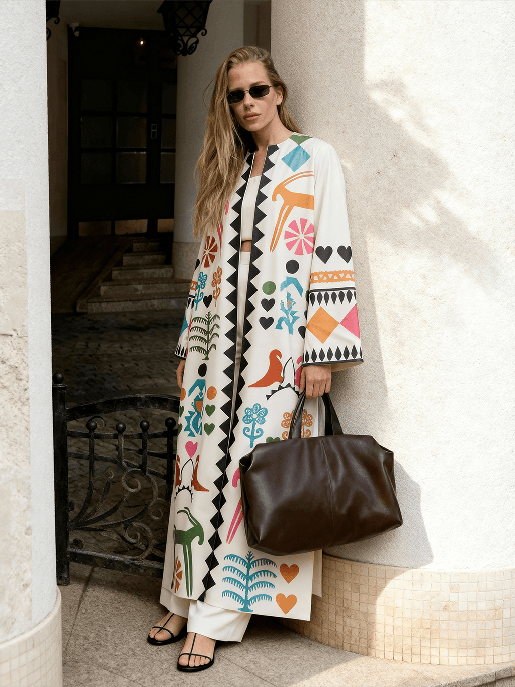 Meso Caramel long kimono styled outdoors, featuring hand-printed motifs and a relaxed, flowing silhouette