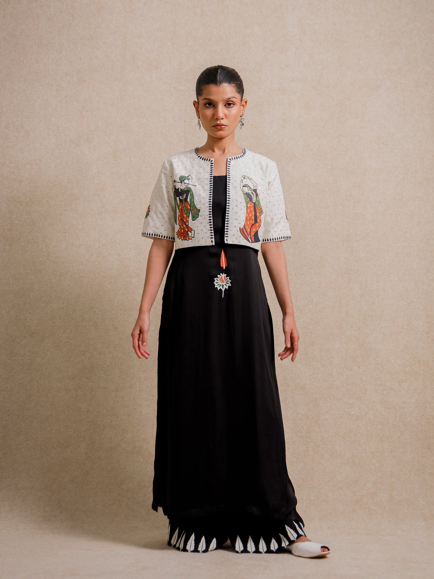 Front view of Eternal Lovers white three piece set featuring hand illustrated figures on a cropped jacket with flowing black skirt