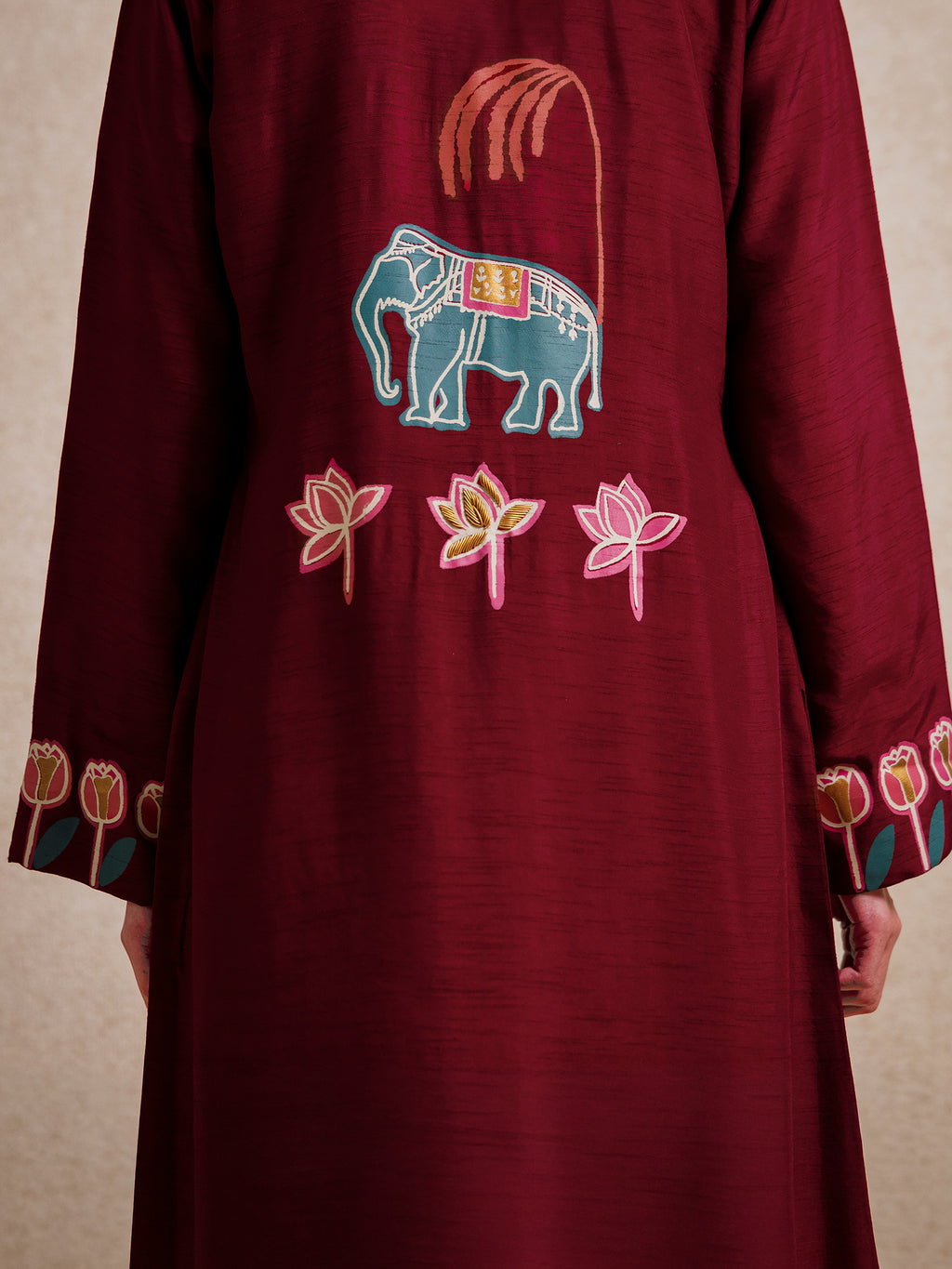 Close-up of elephant and lotus embroidery on the back of the Forbidden Love Scarlet long jacket by Rangdasti