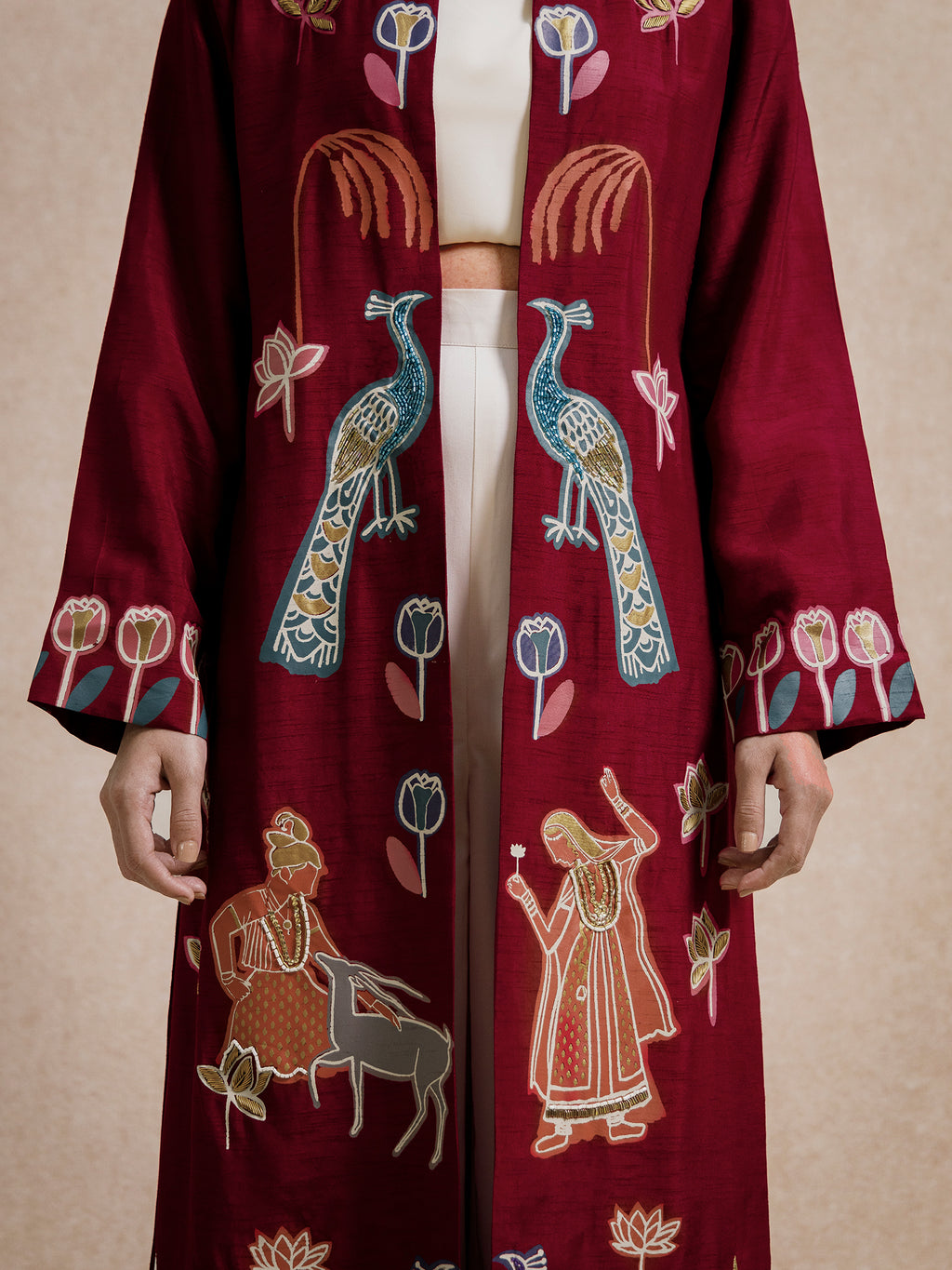 Close-up of peacock and figurative embroidery on the Forbidden Love Scarlet long jacket by Rangdasti