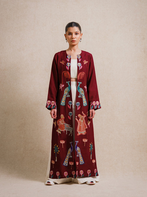 Forbidden Love Scarlet Long Jacket worn by model, hand embroidered detailing on burgundy fabric