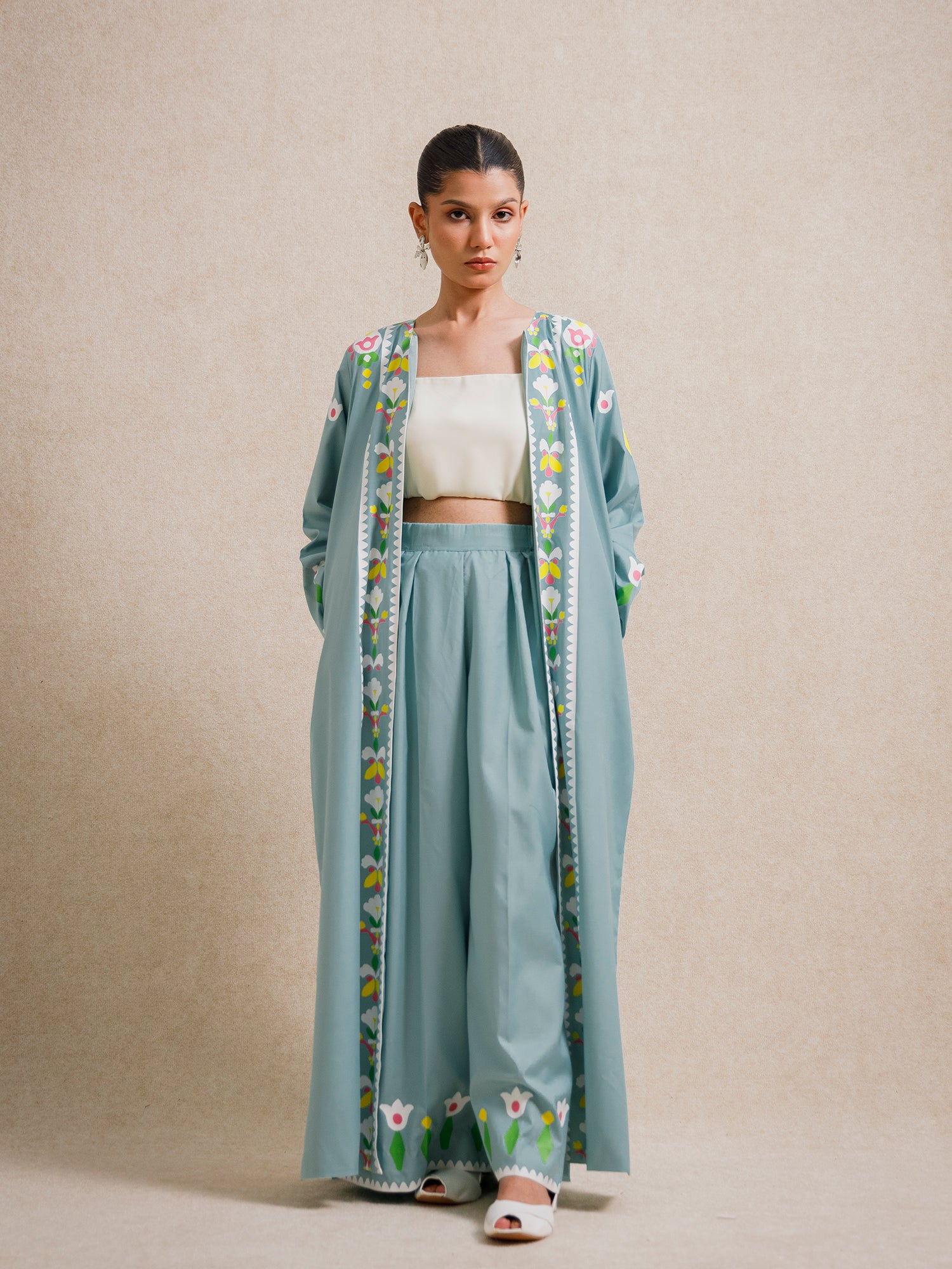 Front view of Tiffany Blue two piece set from the Rooted collection featuring floral screen-printed motifs and relaxed silhouette